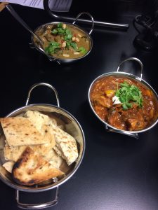 Images of curry dishes and naan bread